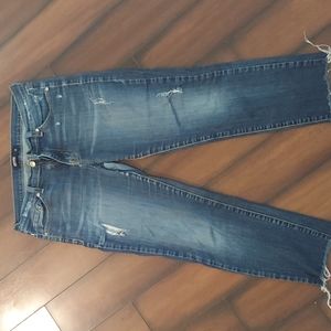 Just Black distressed denim. Ankle length at 5 foot 2 wearer.